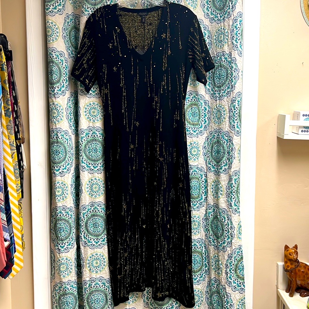 Gold and black lightweight, short sleeve sweater dress in size small.
